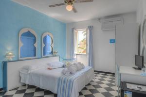 Posteľ alebo postele v izbe v ubytovaní Hotel Arabesque
