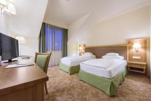 Postel nebo postele na pokoji v ubytování Hotel Sonnenhof