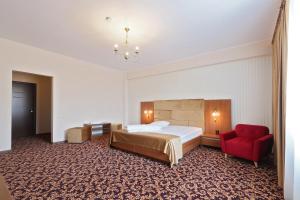 Postel nebo postele na pokoji v ubytování Hotel Impero