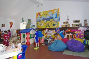 a group of children playing in a room with toys at Rocha Brava Village Resort in Carvoeiro