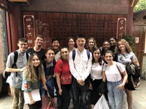 a group of people posing for a picture at Wenjun Courtyard Hotel ---5 mins walk from Tonghuimen metro station, near Tianfu square, close by culture park and Sichuan opera house, English speaking service, local tours in Chengdu