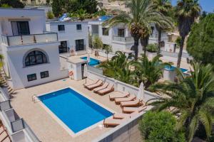 an aerial view of a villa with a swimming pool at Baldacchino Holiday Villas in Mellieħa