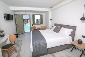 Ein Bett oder Betten in einem Zimmer der Unterkunft Kallos Imar Boutique Hotel
