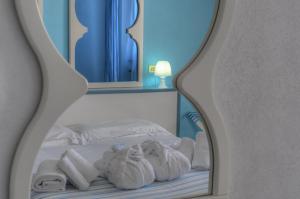 Posteľ alebo postele v izbe v ubytovaní Hotel Arabesque