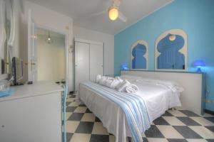 Posteľ alebo postele v izbe v ubytovaní Hotel Arabesque