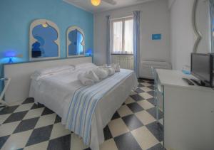Posteľ alebo postele v izbe v ubytovaní Hotel Arabesque