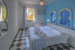 Posteľ alebo postele v izbe v ubytovaní Hotel Arabesque