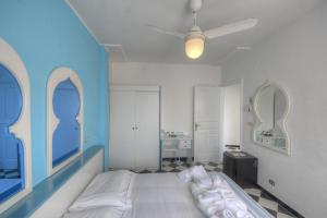 Posteľ alebo postele v izbe v ubytovaní Hotel Arabesque