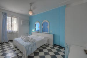 Posteľ alebo postele v izbe v ubytovaní Hotel Arabesque