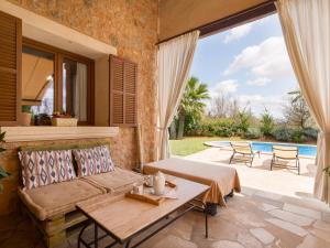 a living room with a couch and a table at Es rafalot in Binissalem