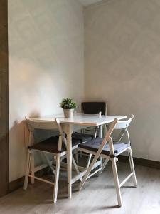 a table and chairs with a potted plant on it at Kvamseter Lodge in Kvamseter