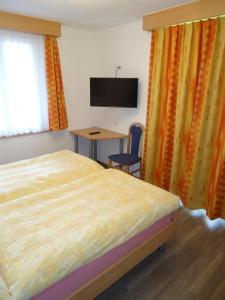 TV a/nebo společenská místnost v ubytování Haus Holiday