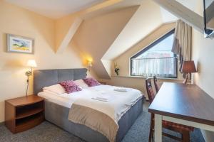 Ένα ή περισσότερα κρεβάτια σε δωμάτιο στο Dom Atalia Wynajem pokoi