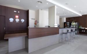 Nápoje v ubytování Hotel Olympia Universidades