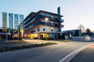 a building on the side of a street at harry's home hotel & apartments in Graz