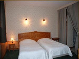 Postel nebo postele na pokoji v ubytování LOGIS - Auberge Du Colombier