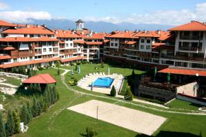 an aerial view of an apartment complex with a swimming pool at Bansko Royal Towers Hotel in Bansko