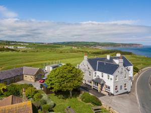 an aerial view of a large white house at The White House Inn - Whitby in Whitby