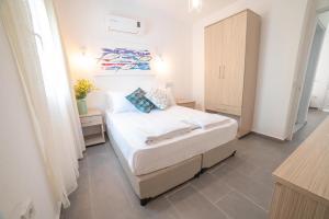 Postel nebo postele na pokoji v ubytování Madda Hotel