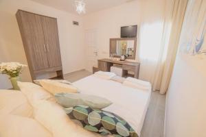 Postel nebo postele na pokoji v ubytování Madda Hotel