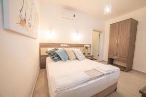 Postel nebo postele na pokoji v ubytování Madda Hotel