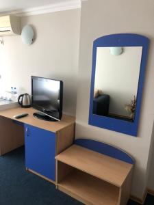 an office with a desk with a computer and a mirror at Guest House Rai in Kiten