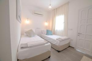 Postel nebo postele na pokoji v ubytování Madda Hotel