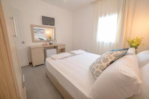 Postel nebo postele na pokoji v ubytování Madda Hotel