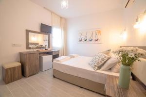 Postel nebo postele na pokoji v ubytování Madda Hotel