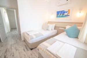 Postel nebo postele na pokoji v ubytování Madda Hotel
