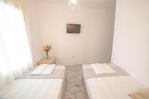 Postel nebo postele na pokoji v ubytování Madda Hotel