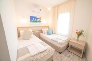 Postel nebo postele na pokoji v ubytování Madda Hotel