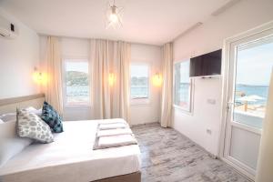 TV a/nebo společenská místnost v ubytování Madda Hotel