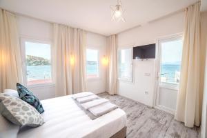 Postel nebo postele na pokoji v ubytování Madda Hotel