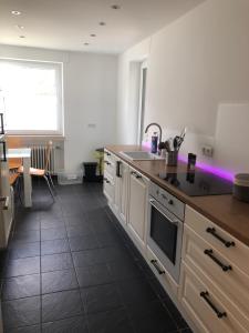 a kitchen with a sink and a counter top at Appartement Elzerland in Mayen
