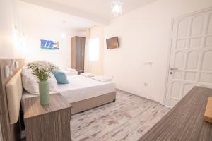 Postel nebo postele na pokoji v ubytování Madda Hotel