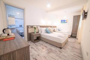 Postel nebo postele na pokoji v ubytování Madda Hotel