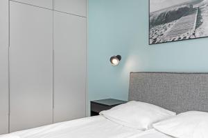 Łóżko lub łóżka w pokoju w obiekcie Apartamenty Gardenia Seaside by Noclegi Renters