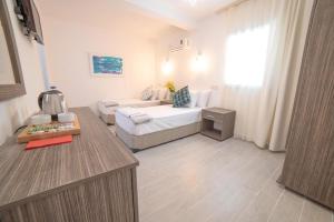 Postel nebo postele na pokoji v ubytování Madda Hotel