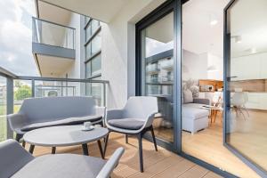 Część wypoczynkowa w obiekcie Apartamenty Gardenia Seaside by Noclegi Renters