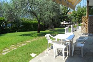 a white table and chairs sitting on a patio at Viki Studios and Apartments in Skala Potamias