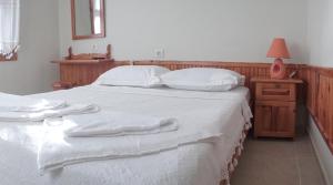 A bed or beds in a room at Totelya Hotel