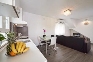 Kuchyň nebo kuchyňský kout v ubytování Apartment Epetij 2