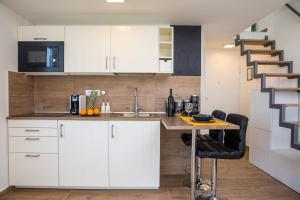 Kuchyň nebo kuchyňský kout v ubytování Apartment Velvet