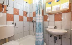 a bathroom with a toilet and a sink at Holiday Home Nada in Tučepi