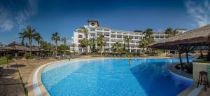 a large swimming pool in front of a hotel at SH Villa Gadea in Altea