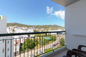 a balcony with a view of a city at The Red Hotel - Adults Only in San Antonio