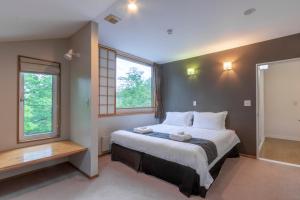 Katil atau katil-katil dalam bilik di Fresh Powder Accommodation