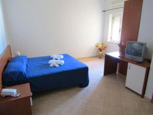 Säng eller sängar i ett rum på Grand Hostel Calabria