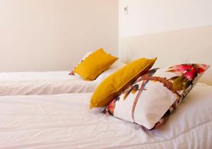 A bed or beds in a room at Residence delle Tre Corone